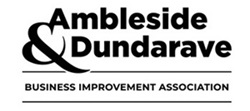 The image features a black and white logo for the Ambleside Dundarave Business Improvement Association. It showcases stylized text and employs graphic design elements focusing on typography. The design is clear and emphasizes the association's identity through its monochromatic color scheme.