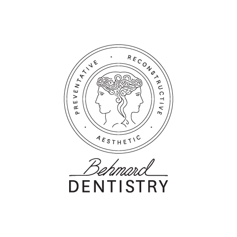 The image is a logo design, presented in a clean, minimalist, black and white line art style against a white background. The logo is divided into two main sections.  The upper section features a circular emblem. Within this circle, two stylized profile heads are depicted, facing away from each other. The heads are in profile, with delicate, classical-inspired features. The left head faces left, and the right head faces right. Both heads are rendered with intricate, swirling patterns for their hair, reminisc
