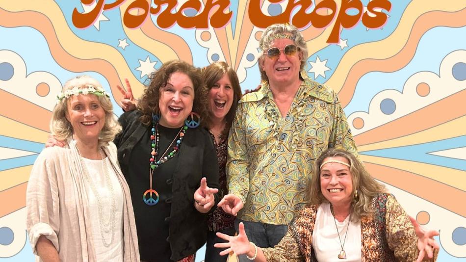 The image is a vibrant, medium shot of five people dressed in 1970s-inspired fashion, posing in front of a psychedelic, colorful backdrop. The backdrop features large, wavy bands of color in pastel shades of blue, light orange, and cream, interspersed with circles and starburst shapes, reminiscent of the era's art and design.