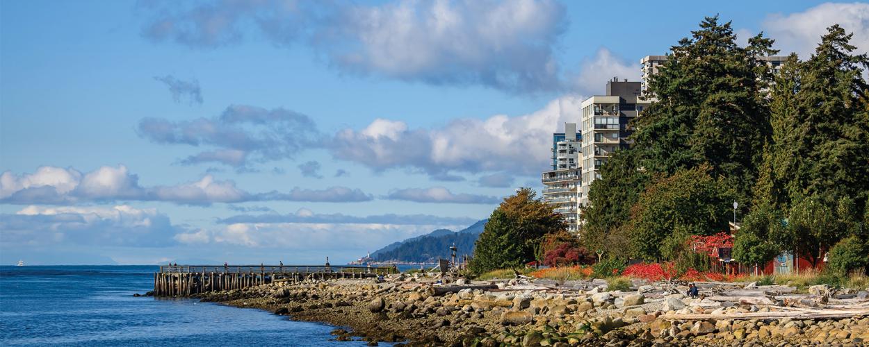 A waterfront view of the John Lawson Park playground and pier. Text reads "2025 Budget".