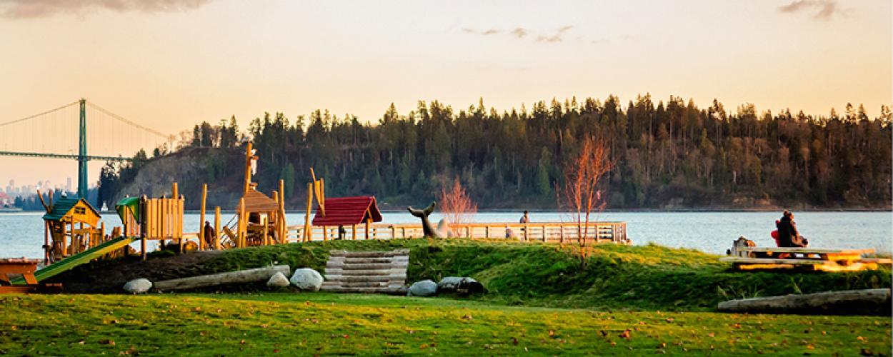 A small playground on the edge of the water. 