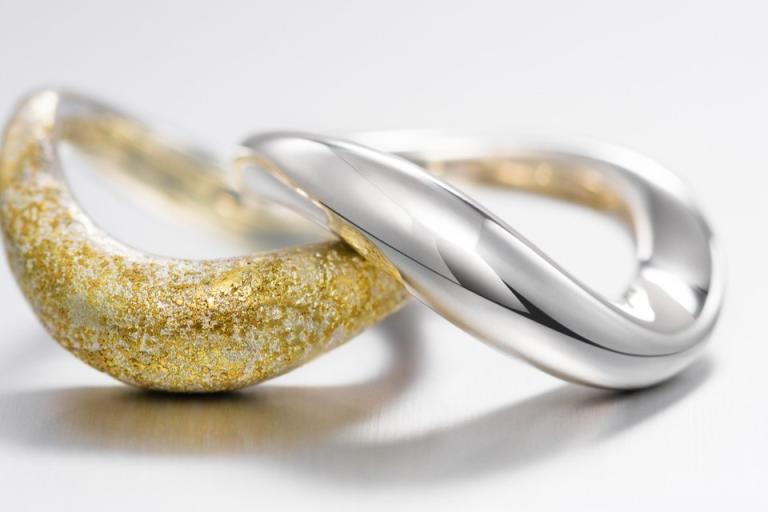 This is a close-up image of a ring, showcasing its intricate details. The ring features platinum and is adorned with a stunning gemstone, likely a diamond, which enhances its appeal as a fashionable accessory. It can serve as an engagement or pre-engagement ring and adds a touch of bling-bling to any jewelry collection. Other materials like silver may also be present in the design, highlighting the versatility of body jewelry.